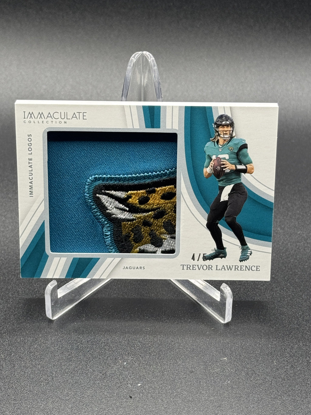 2023 Panini Immaculate Collection #IL-TLAW Trevor Lawrence Immaculate Logos #/5