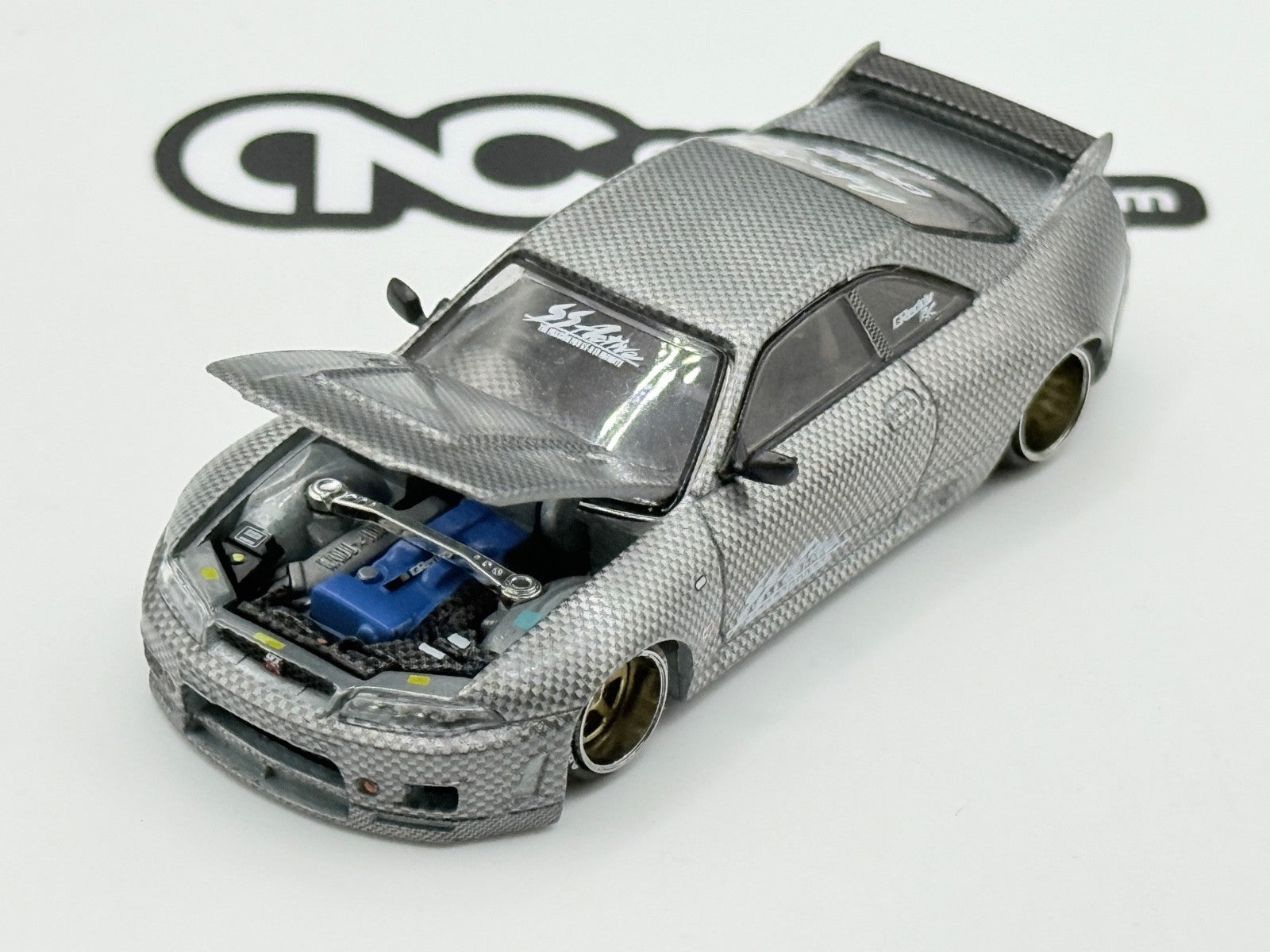 Kaido House x Mini GT KHMG116 Nissan Skyline GT-R (R33) Active Carbon R CHASE