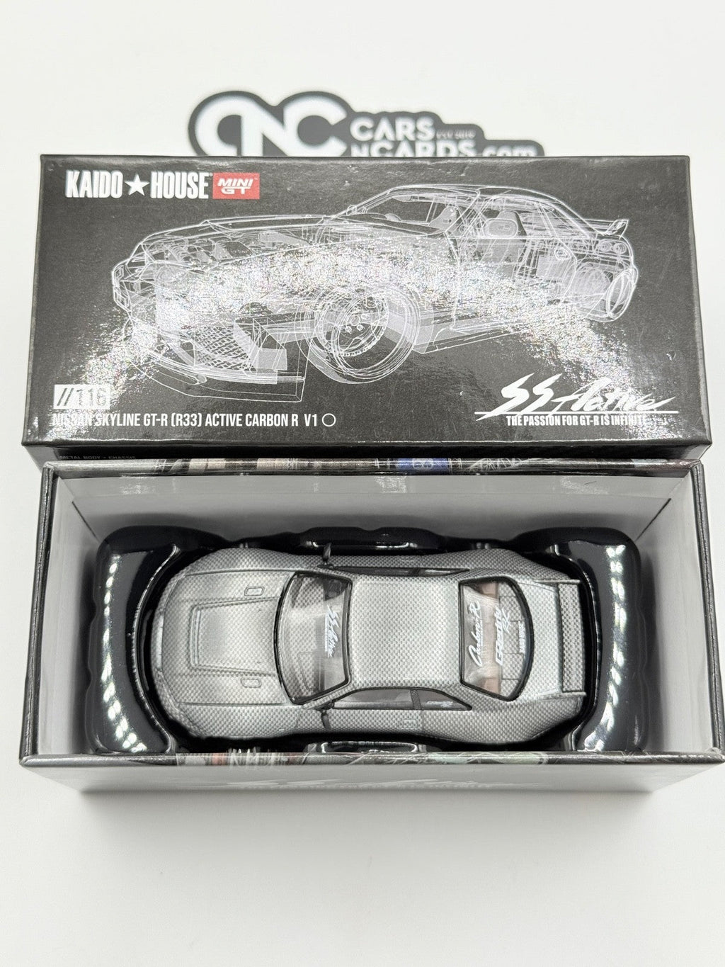 Kaido House x Mini GT KHMG116 Nissan Skyline GT-R (R33) Active Carbon R CHASE